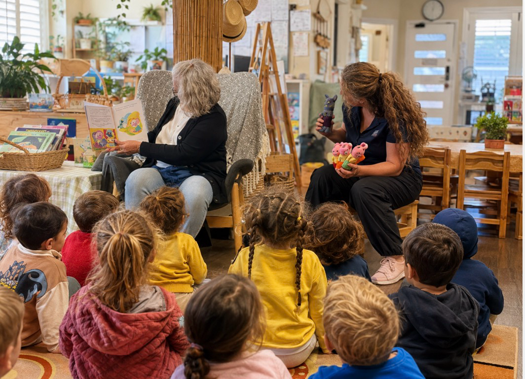 A grandparent sharing a story with children at Lakeview Preschool