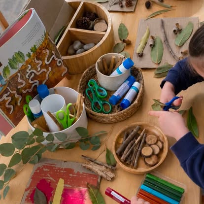 Children exploring natural materials during a creative learning experience